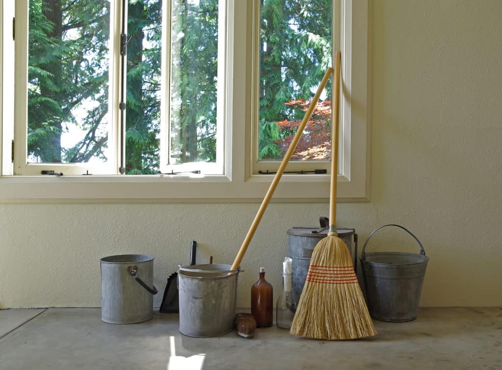 Vintage cleaning supplies in room with an open window.